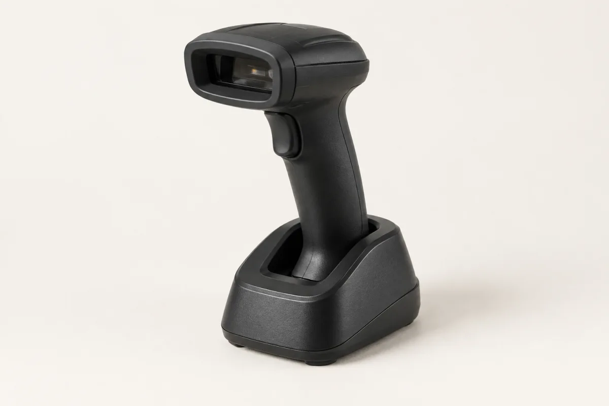 Illustrative black barcode scanner in its stand.