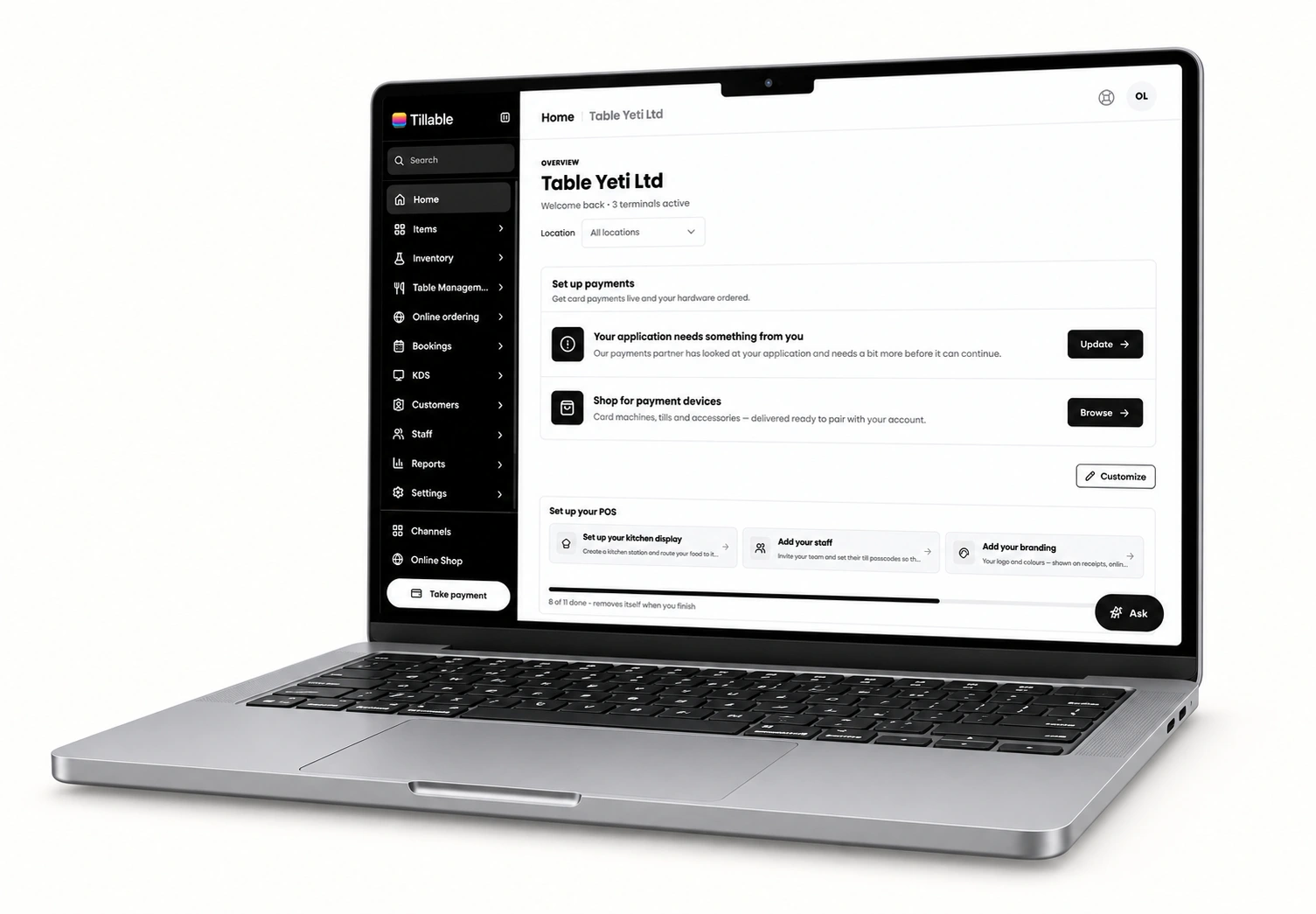 Tillable dashboard on a silver MacBook at a slight angle, showing sales, inventory, bookings, customers, staff and reports.